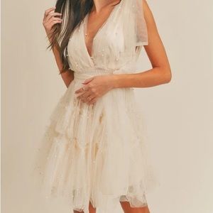 Medium size mini women’s Tulle Cream dress with white pearls worn once
